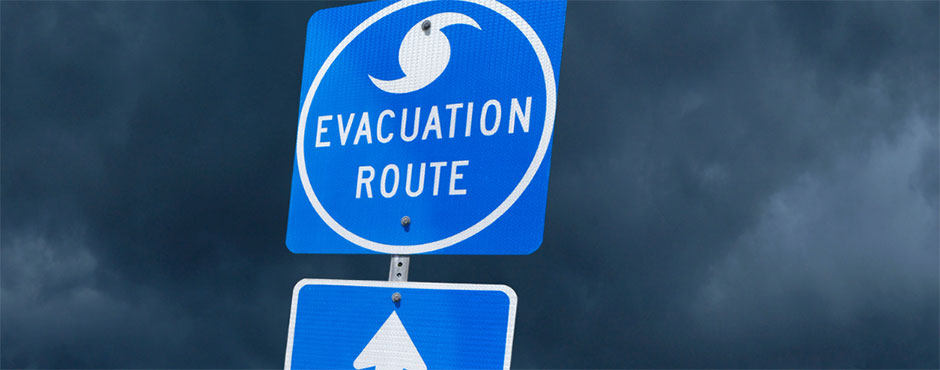 evactuation route sign against stormy looking backrgound
